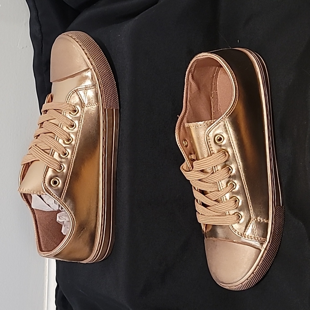 Metallic rose gold low top sneakers